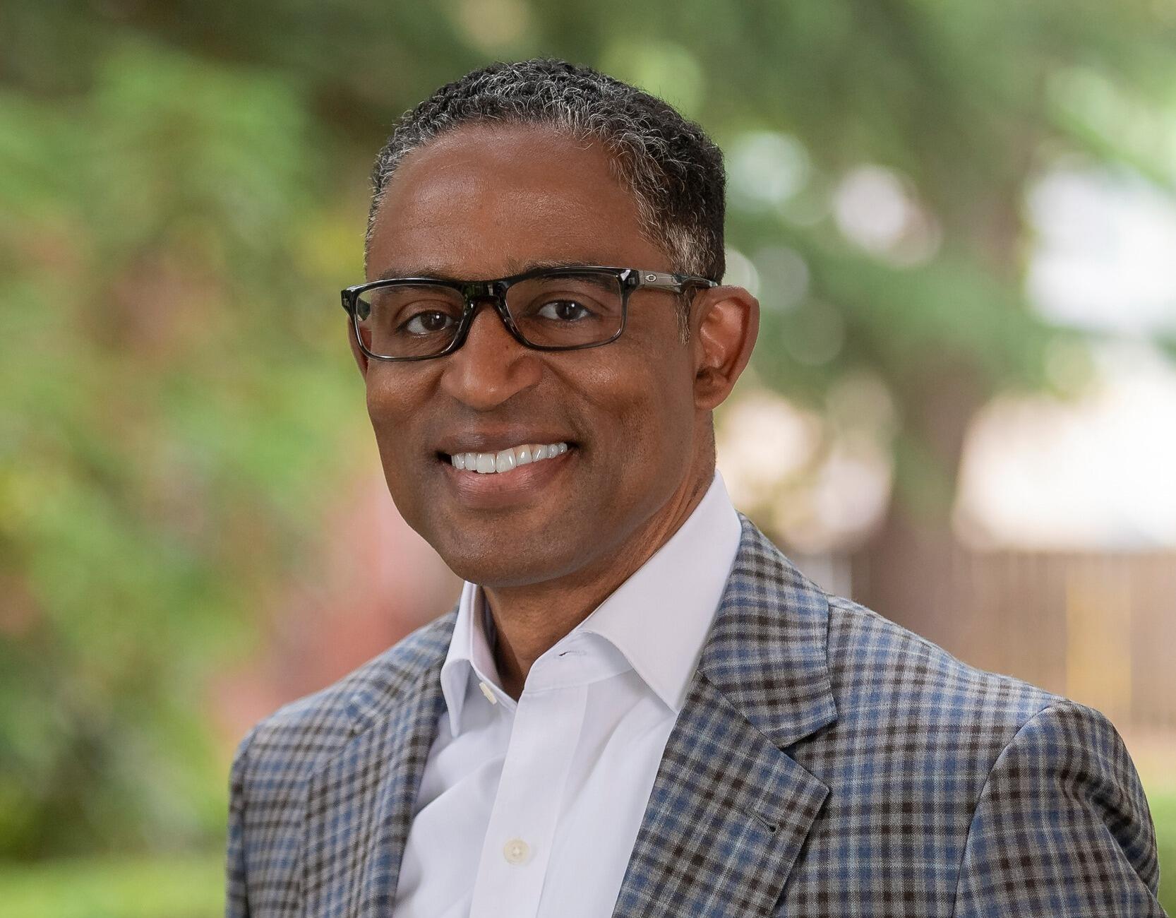 A photo of a man from the chest up. 