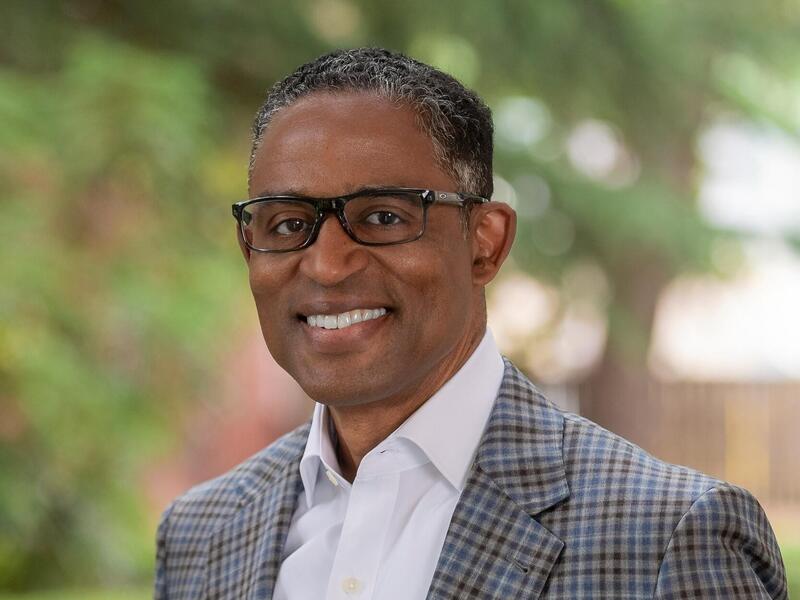 A photo of a man from the chest up. 