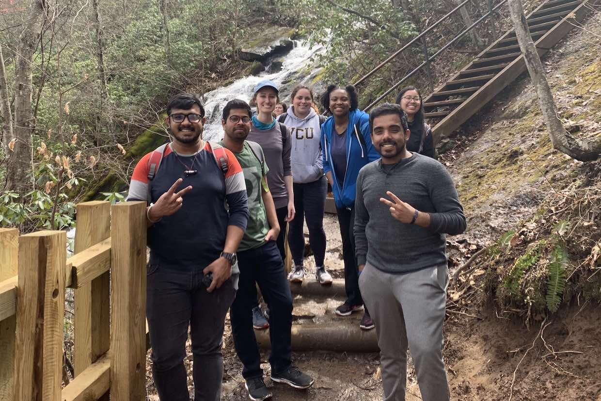 A group of V C U students standing on a pathway.