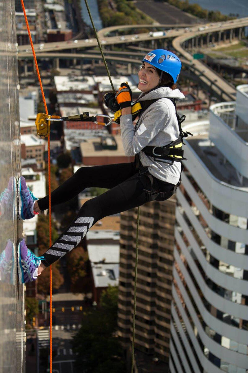 Hailey Spencer rappels from the SunTrust Center. 
Courtesy of Dave Parrish Photography