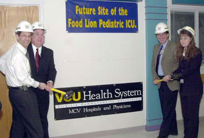 From left: Dr. Sheldon Retchin, senior executive vice president and CEO of the VCU Health System; Mark Adkins, Food Lion store operations supervisor; Dr. Joe Laver, chair Department of Pediatrics; Lisa Powers, Food Lion district manager.

Photos by Tommy Bishop, VCU Creative Services