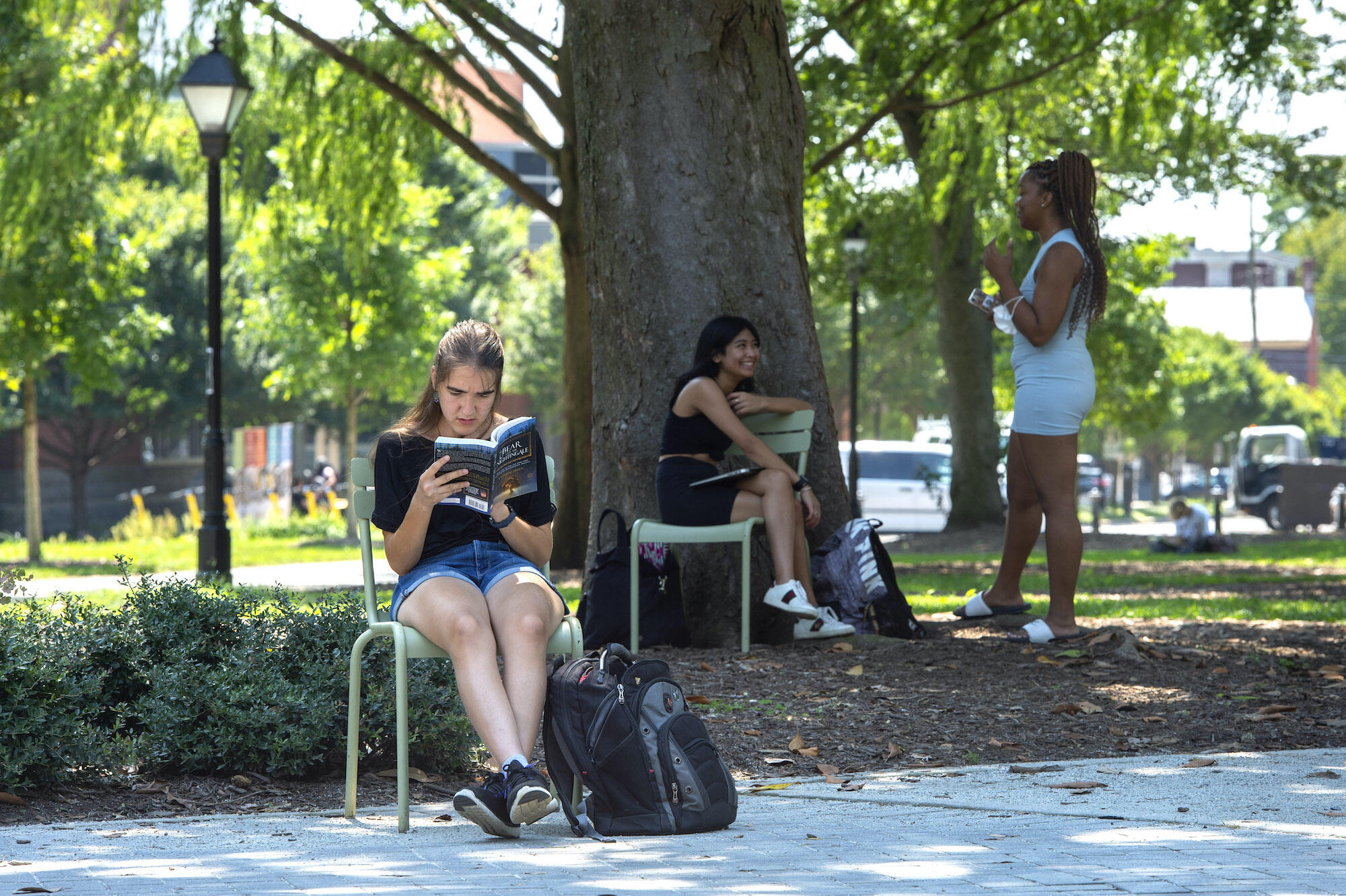 Accounting major Alyssa Sandlin reads a book in Monroe Park