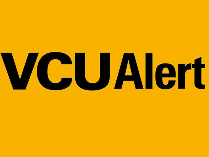 A yellow block that says \"VCUAlert\" in black letters. To the right of the text is a black circle with a yellow exclamation point in it. 