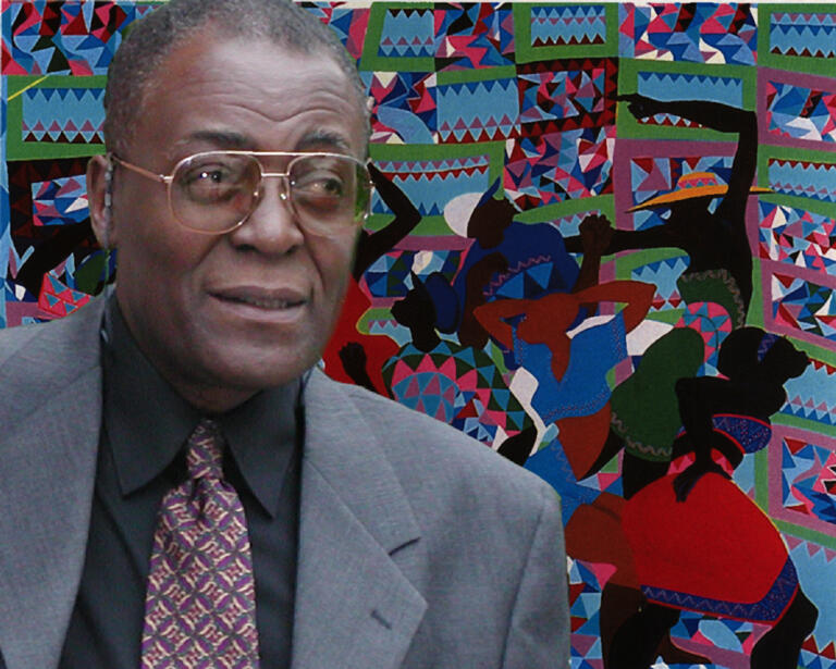 Murry DePillars with a painting in the background.