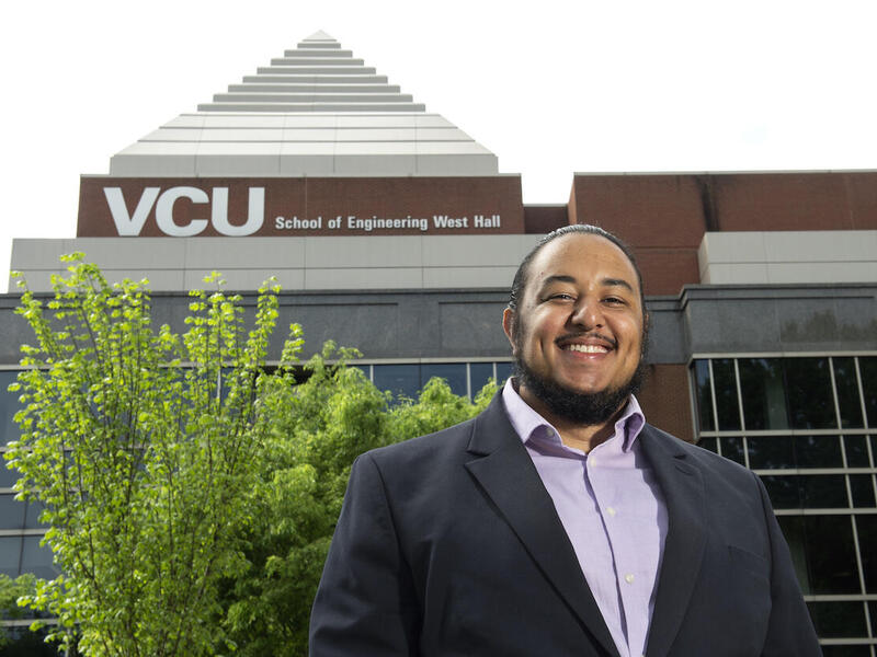 VCU student Myles Boyd standing in front of Engineering West Hall.