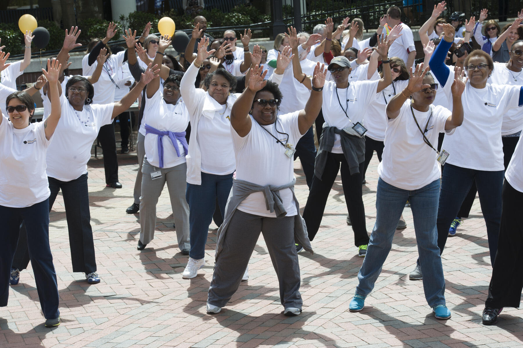 Participants warming up with Eric West, Ph.D., assistant director of recreational sports, before beginning the walk.