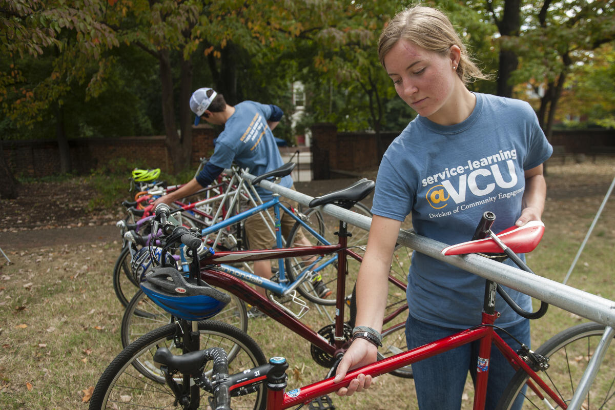  Students are serving as bike valets during the UCI Road World Championships, part of an effort to encourage spectators to bike to the course.
<br>Photo by Steven Casanova, University Marketing.