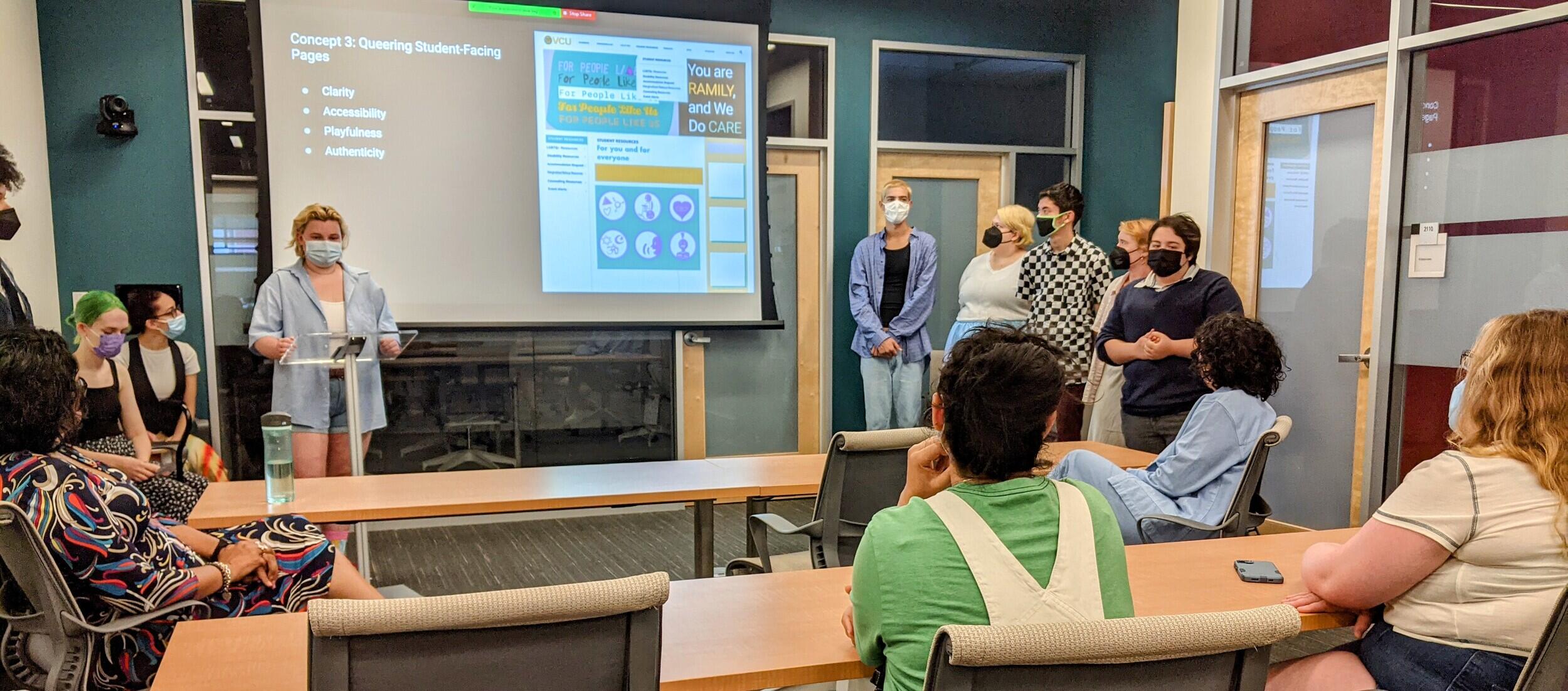 A student giving a presentation in front of a projection. 