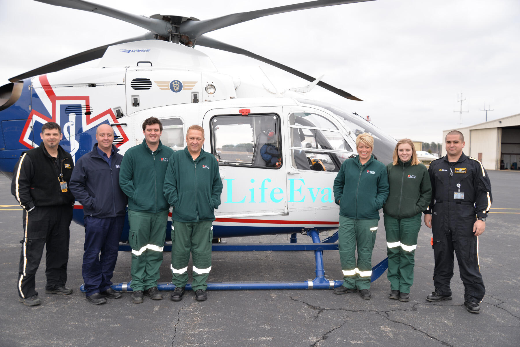 VCU Health LifeEvac crew members teach visitors from Australian Catholic University about their work.