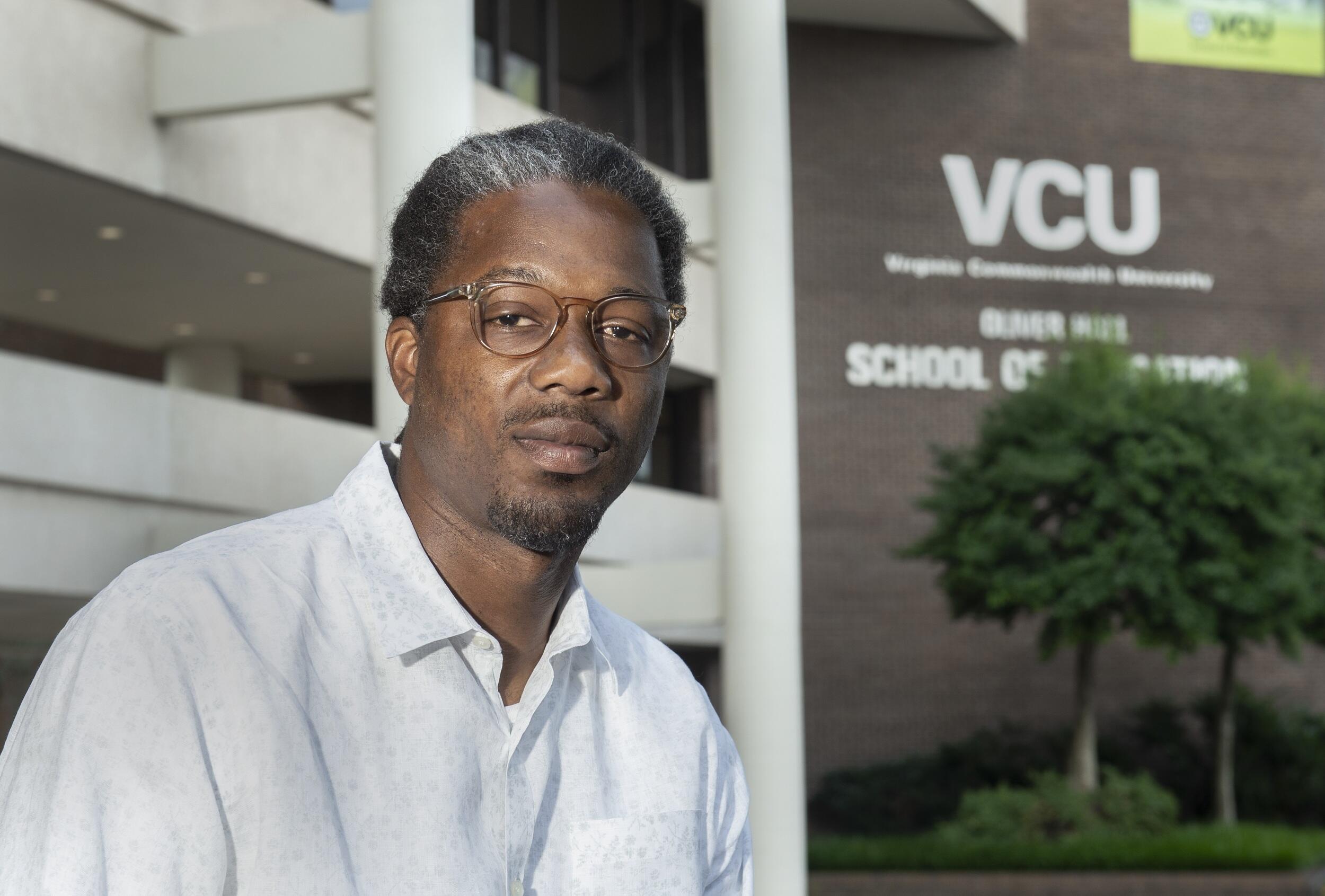 Dwayne Ray Cormier, Ph.D., pictured in front of the VCU School of Education building.