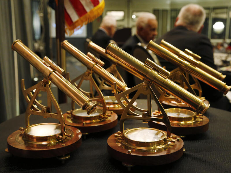 A photo of six awards sitting on a table. 