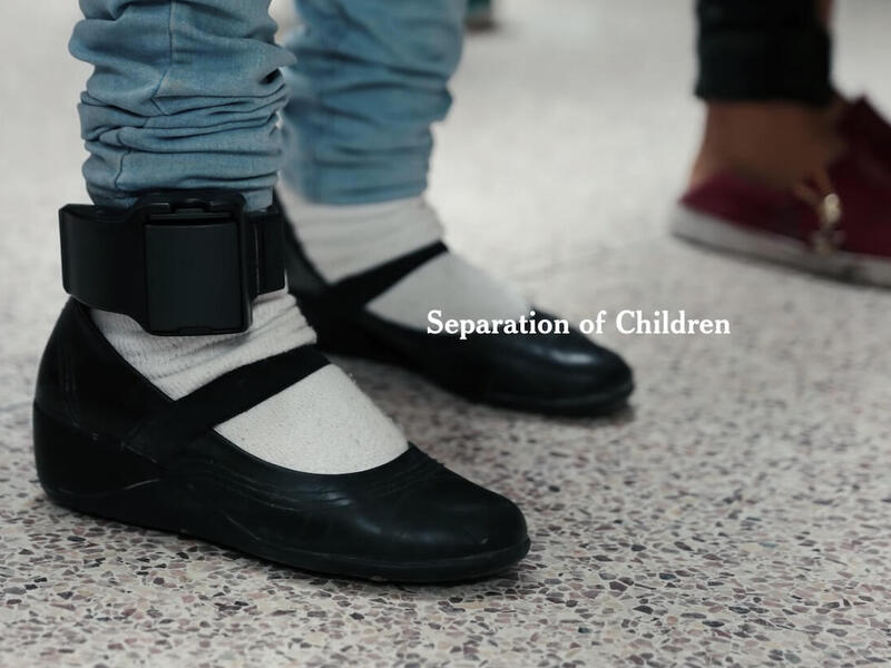 Two pairs of feet shown, one pair shows an electronic monitoring bracelet around its right foot. The words \"separation of children\" are displayed overtop.
