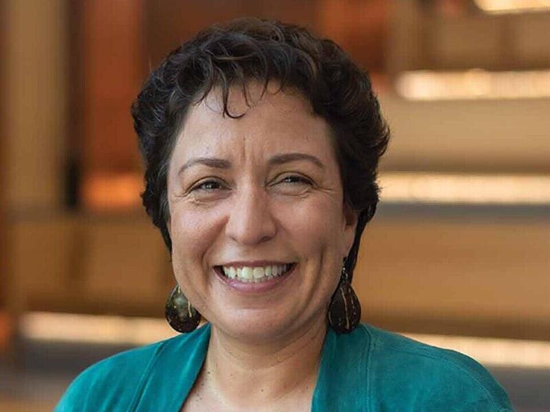 Portrait of Tanya Gonzalez in front of stairs.