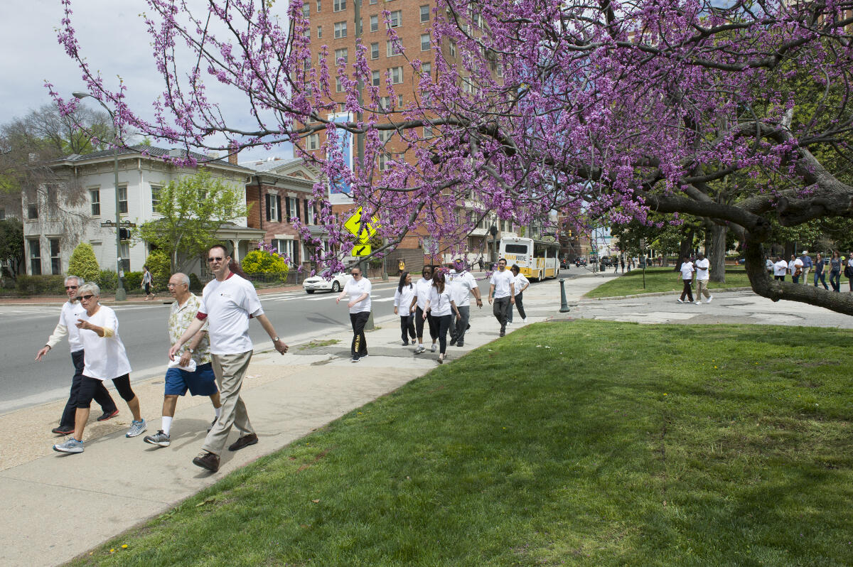 Participants walking the walk-a-thon route in Monroe Park on April 16.