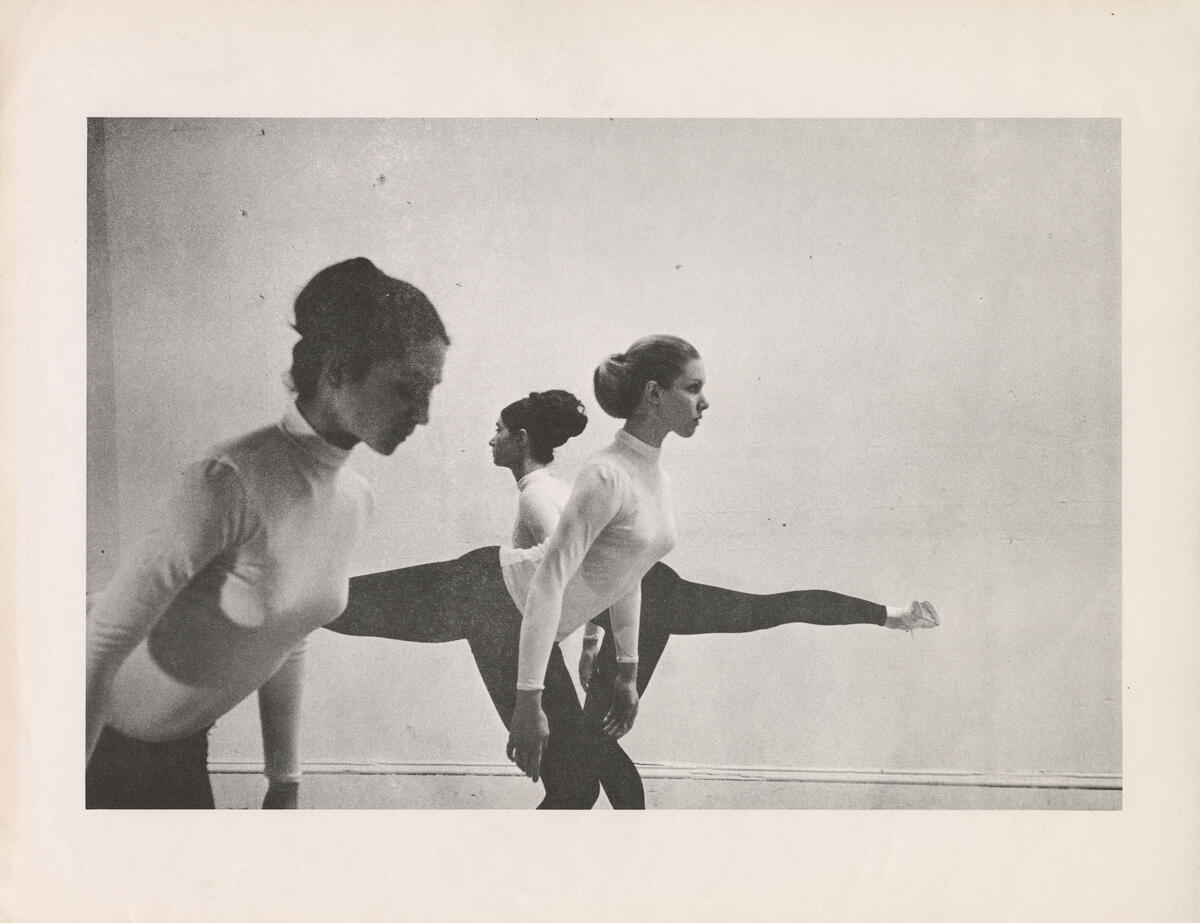 Old photo of three women dancing.
