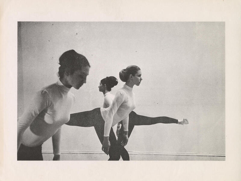 Old photo of three women dancing.