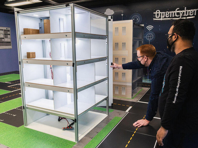 Two men looking at a model