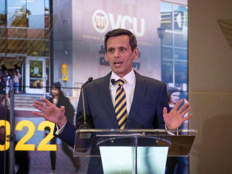 Michael Rao speaks into a microphone.