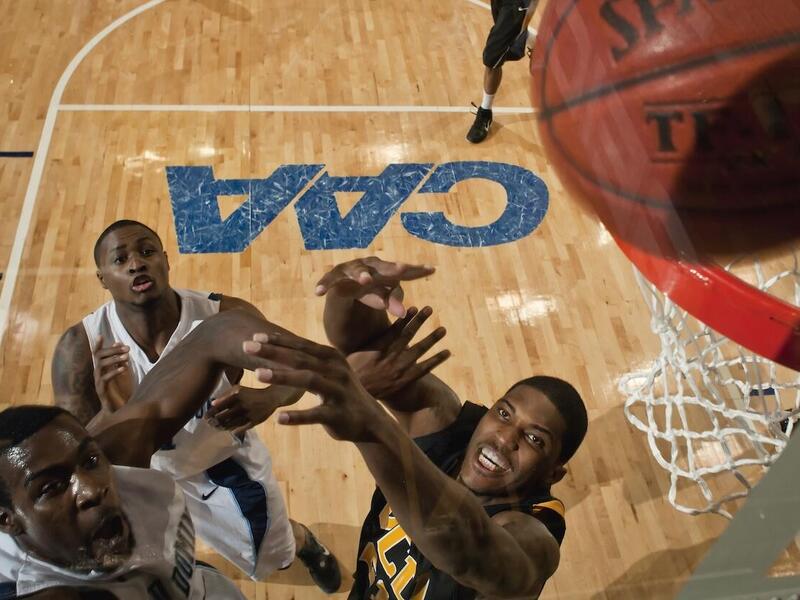 Jamie Skeen jumps for a rebound at the 2011 CAA tournament.