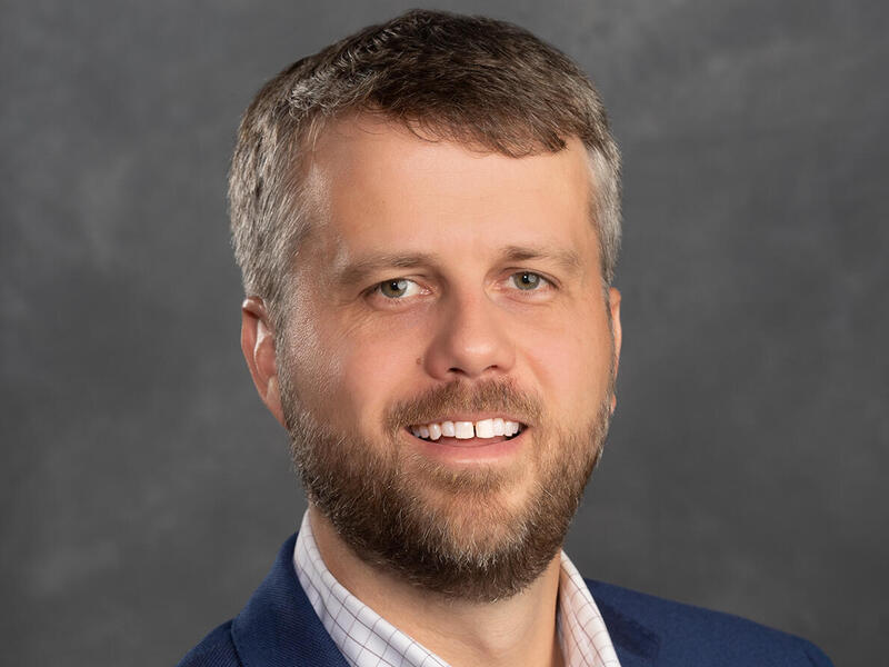 A photo of a man from the shoulders up