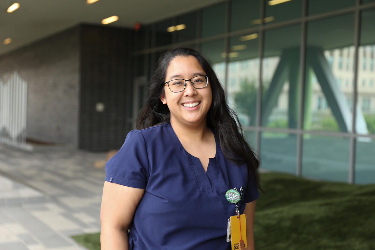 A photo of a woman from the waist up. 