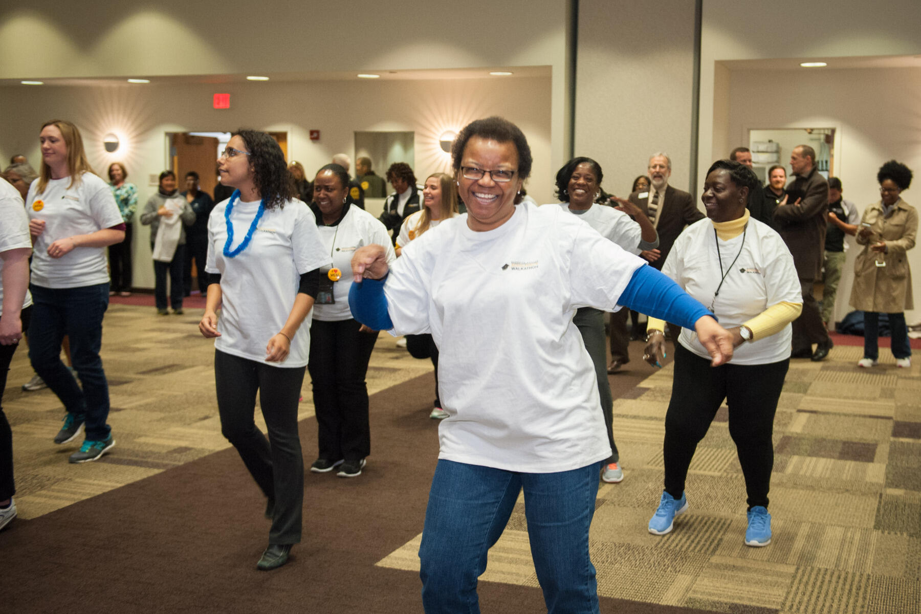 Participants warm up before this year's walk-a-thon.