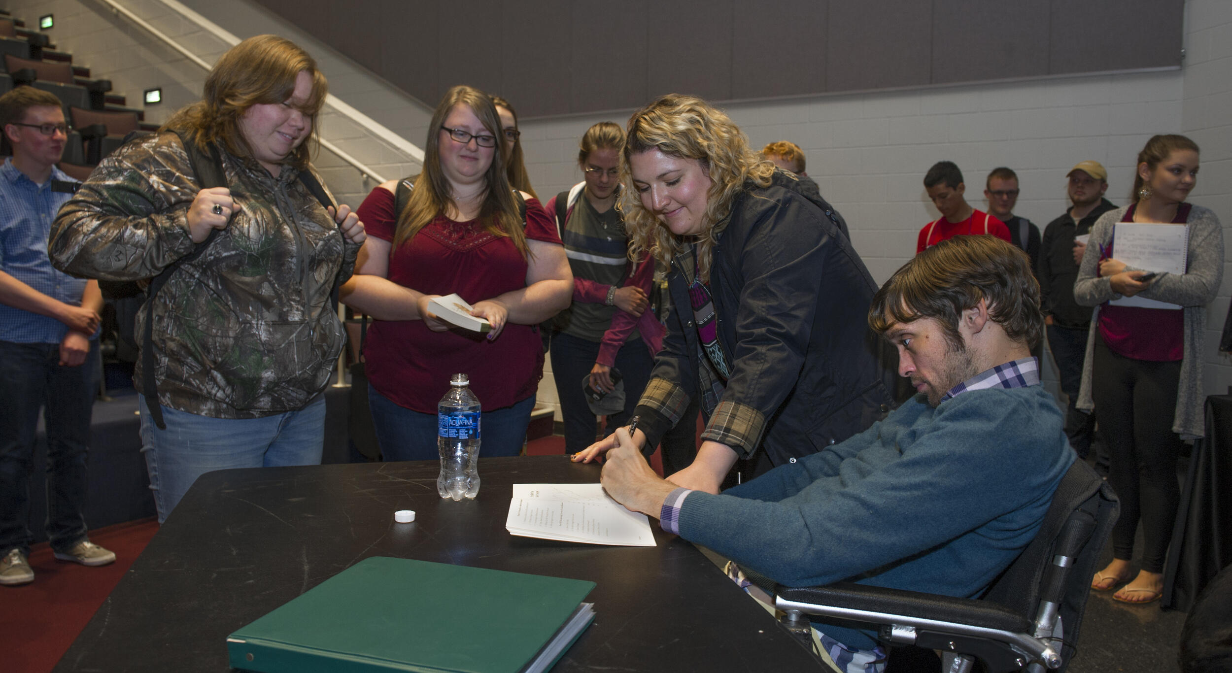 Anner signs copies of his book following the event. (Photo credit: Kevin Morley)