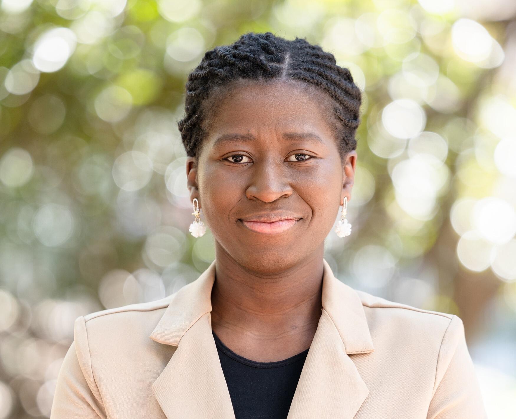 A photo of a woman from the shoulders up. 