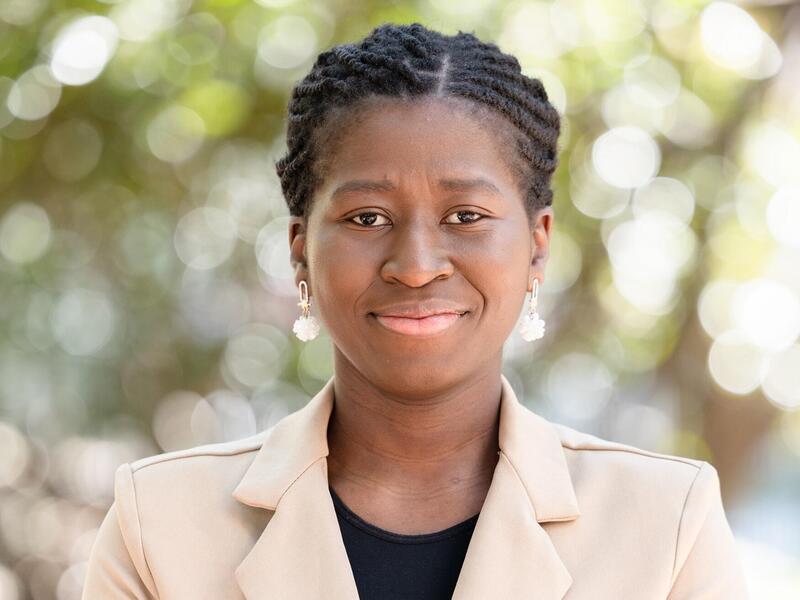 A photo of a woman from the shoulders up. 