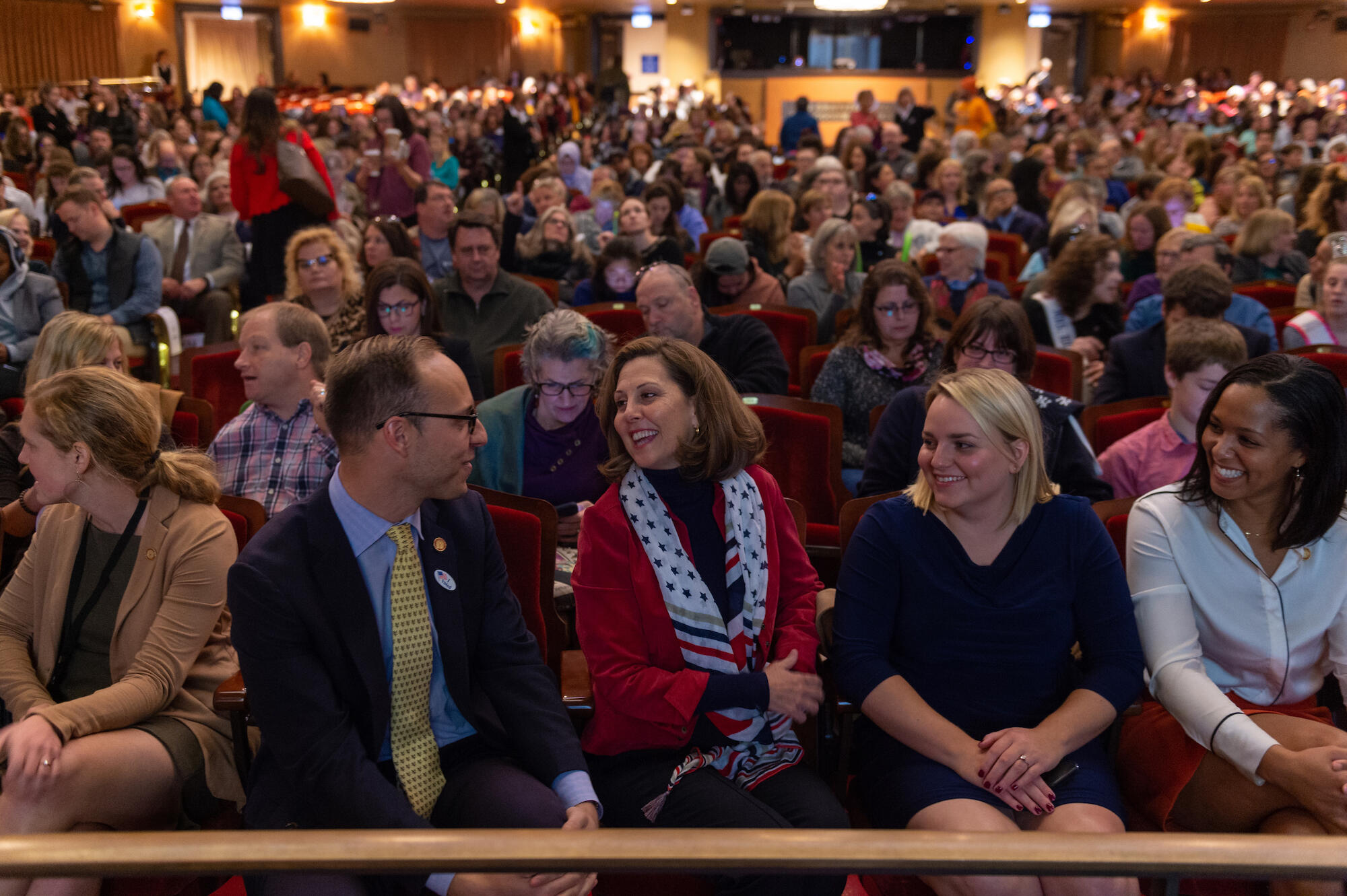 A seated audience at a theater.