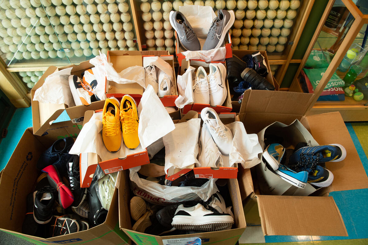 A photo of 10 open boxes with shes in them. 