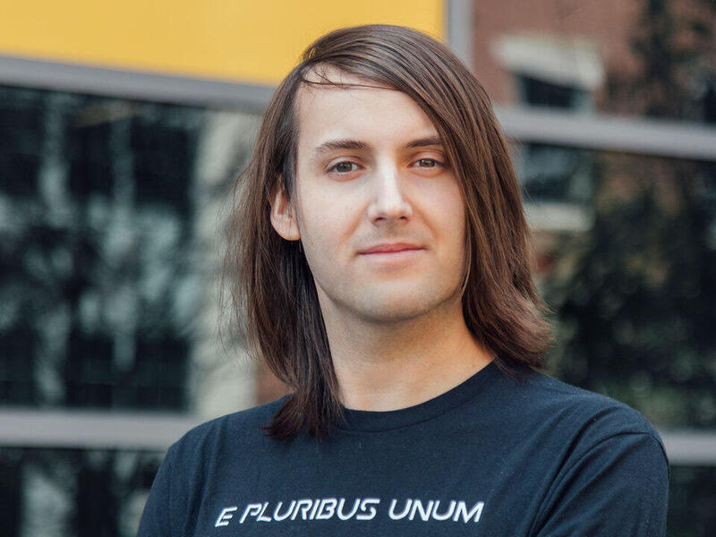 A photo of a man from the shoulders up. 