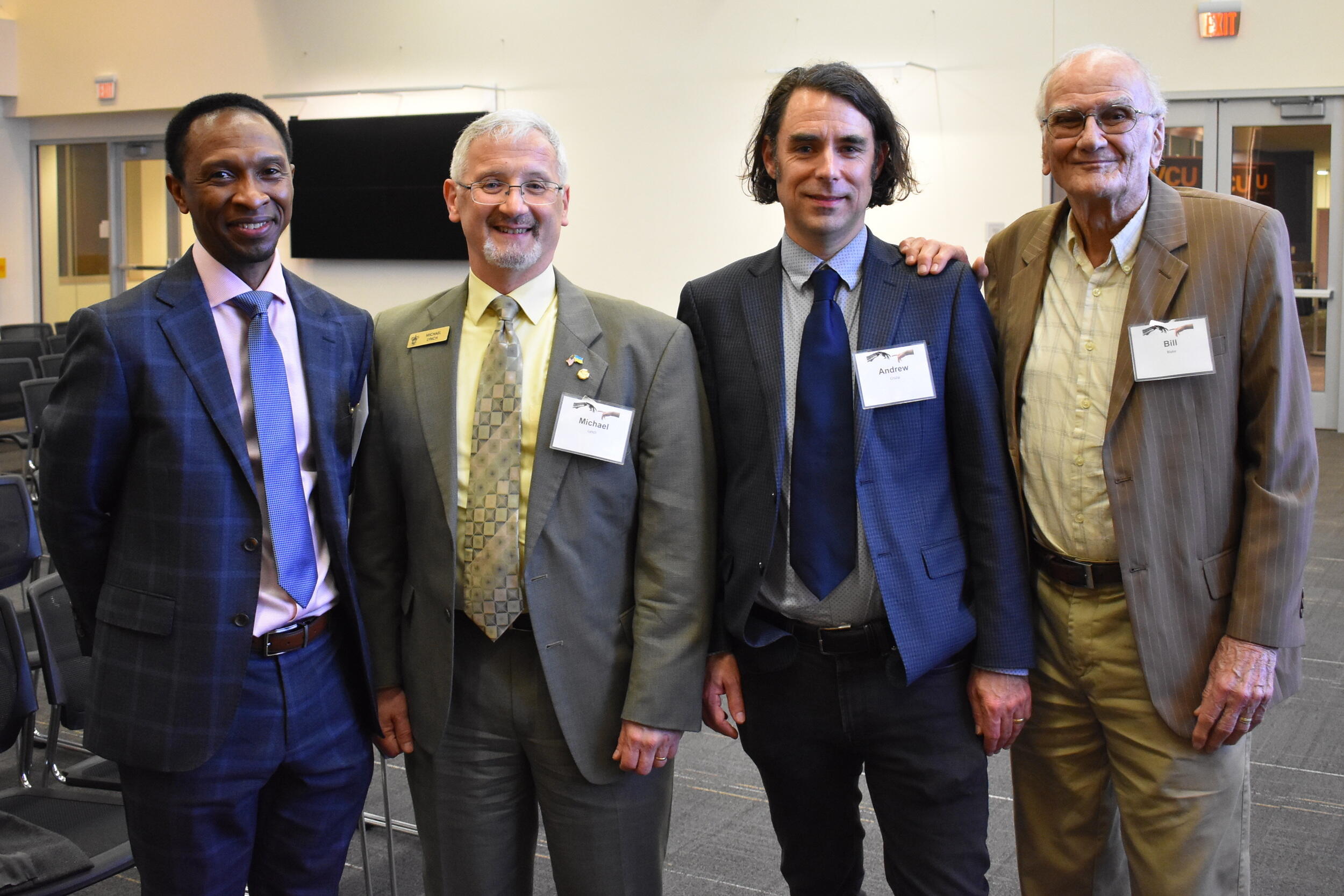 Left to right: Sylvester A, Johnson, Michael Lynch, Andrew Crislip, and William E. Blake.