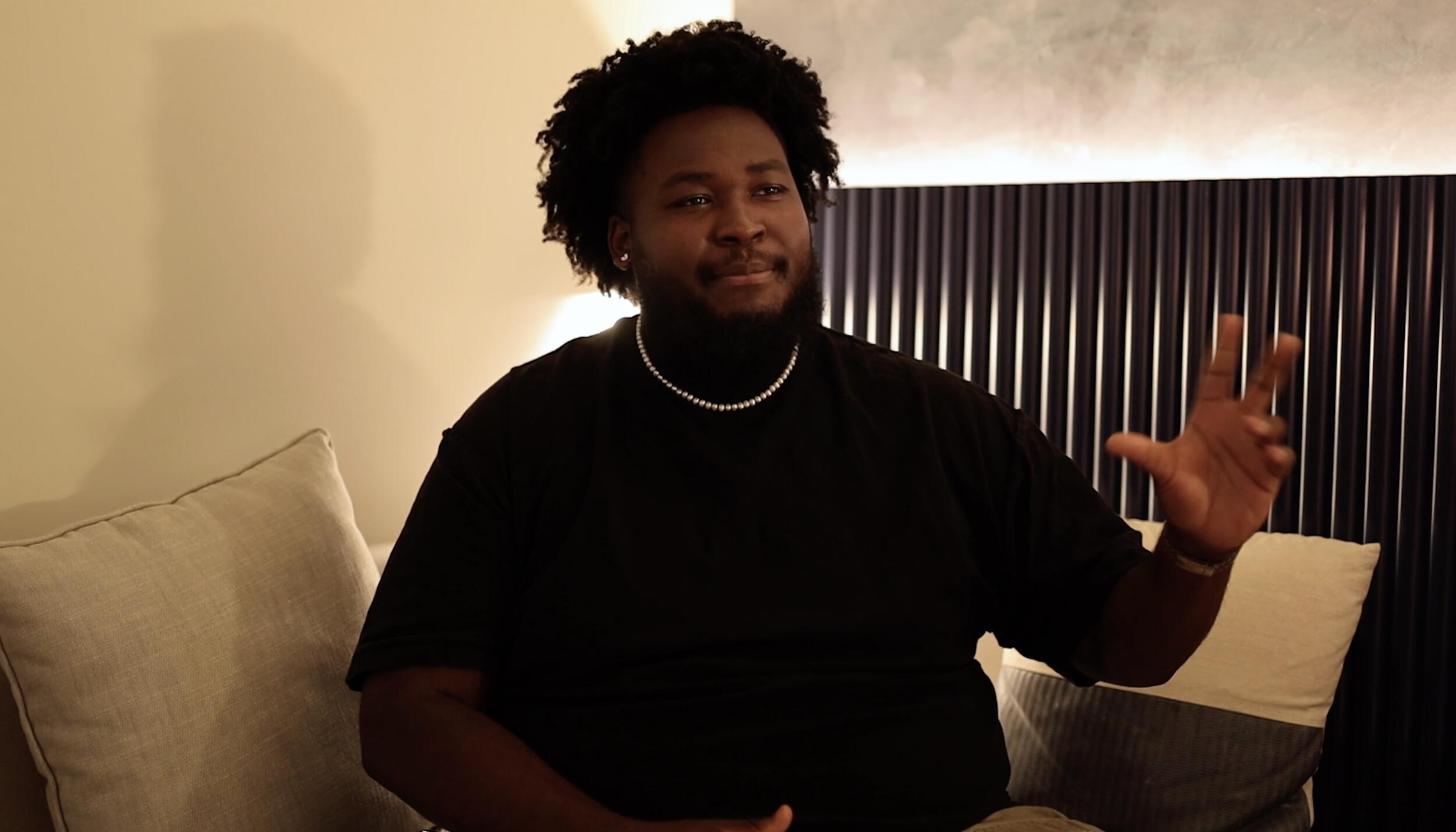 A photo of a man from the waist up. 