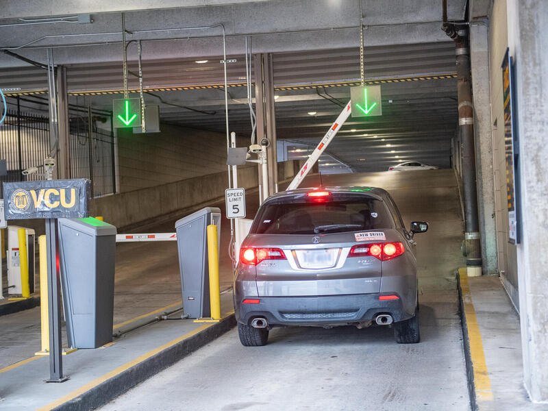 View from behind of a car entering a parking garage.