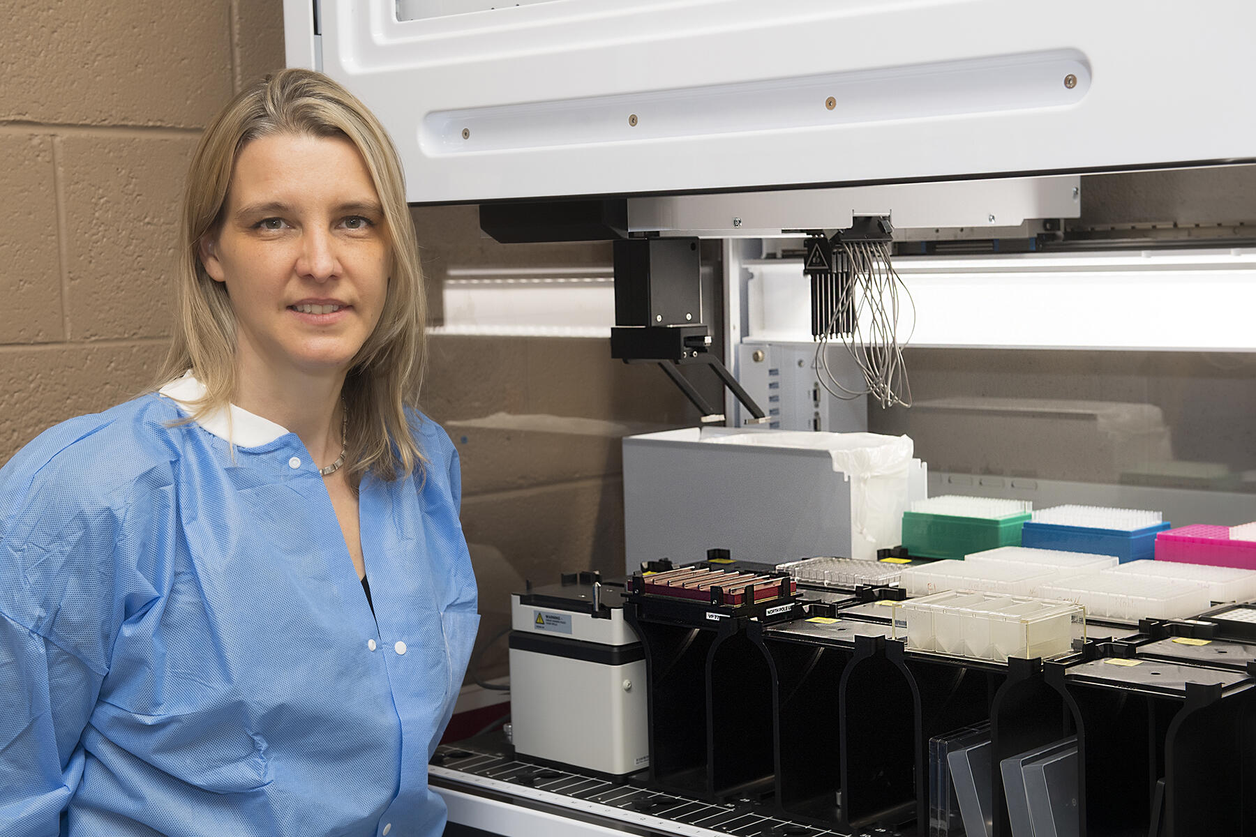 Picture of a woman with lab equipment.