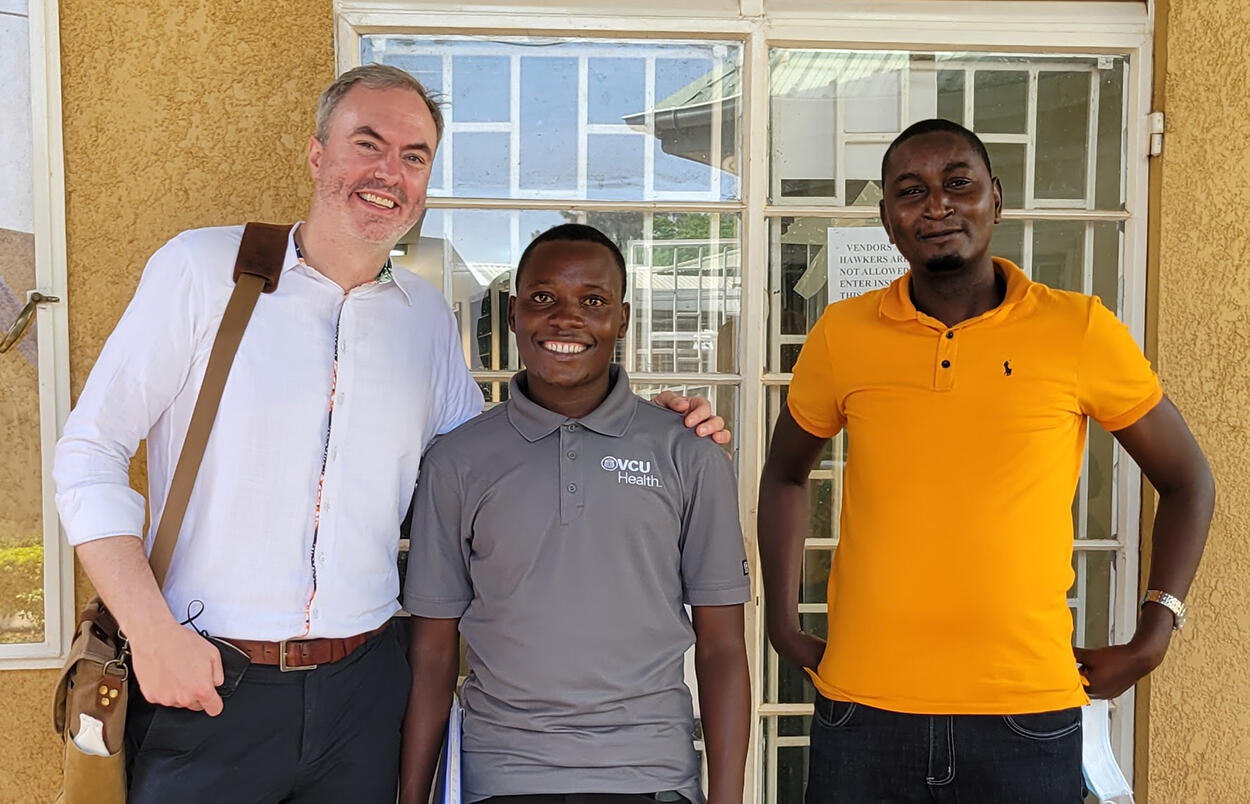 Three men standing next to each other 