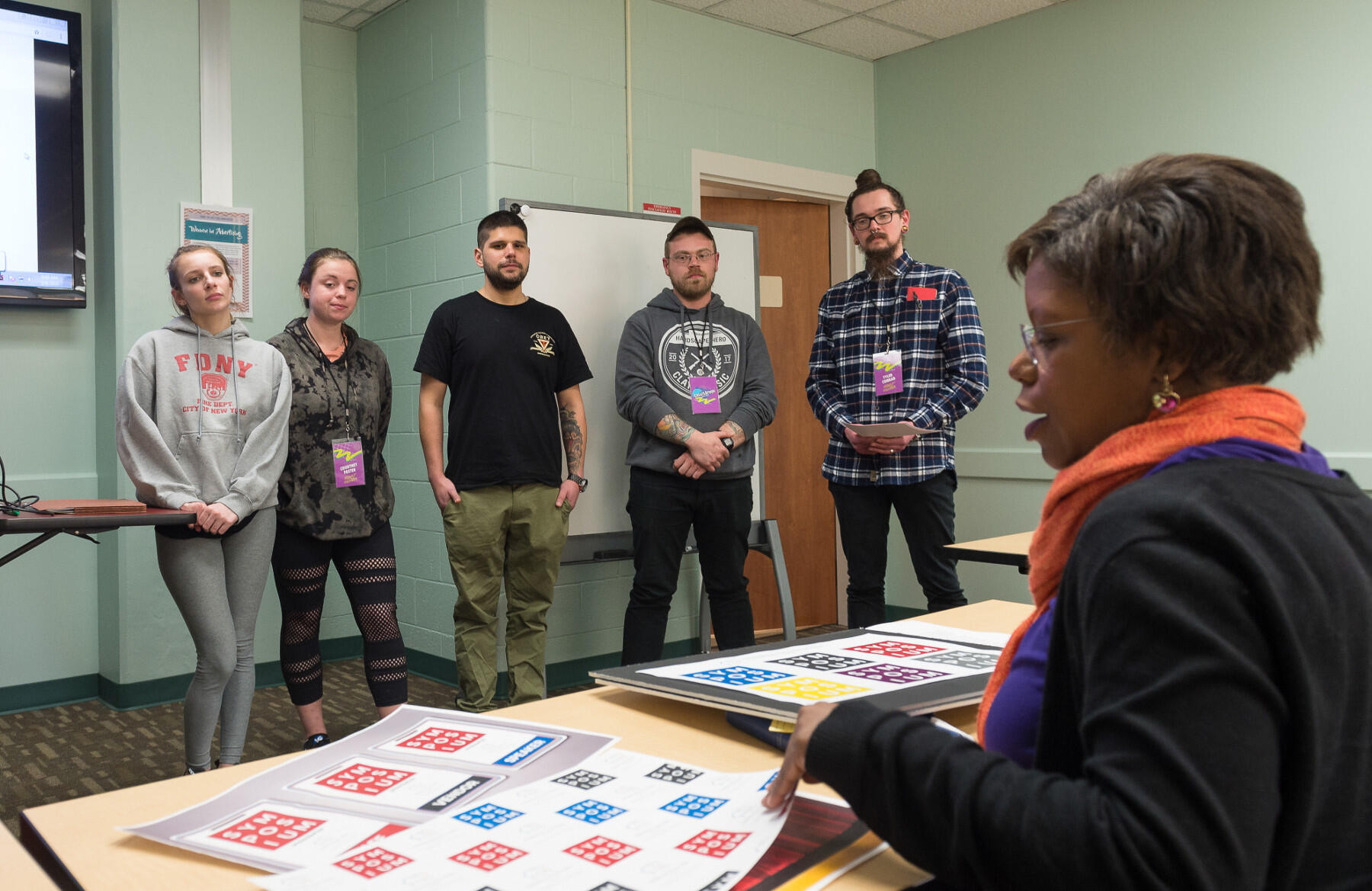 Penelope Carrington, creative services manager for the American Civil War Museum, checks out the marketing material produced for the museum by the team of VCU students.