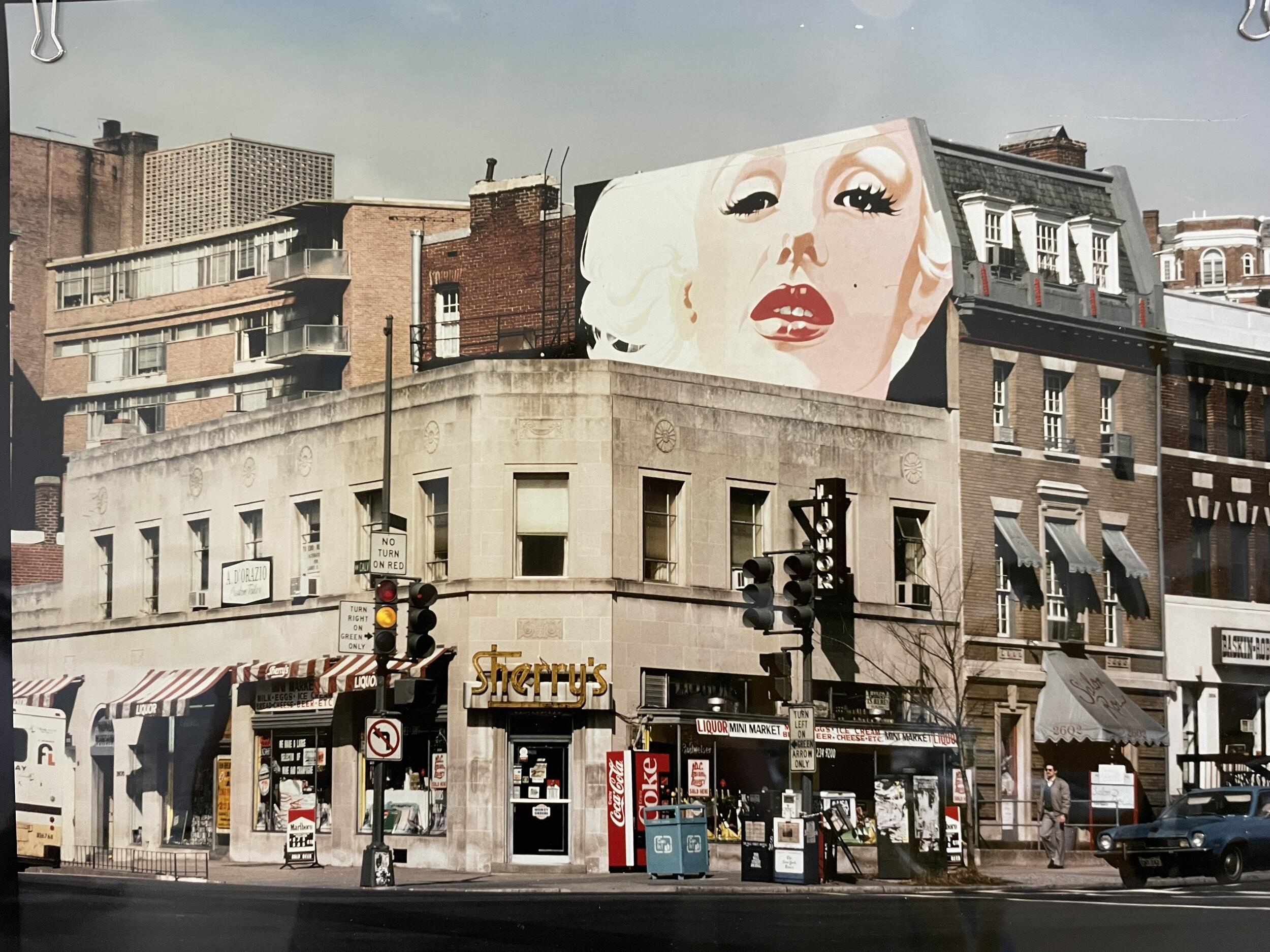A photograph of John Bailey’s mural, “Marilyn,” painted on the exterior wall of Salon Roi