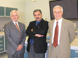 Victor Yanchick (left), Mustafa Al-Hiti and Kenneth Miller pause a moment in the newly renovated undergraduate pharmacy skills lab in the Robert Blackwell Smith, Jr. Building.