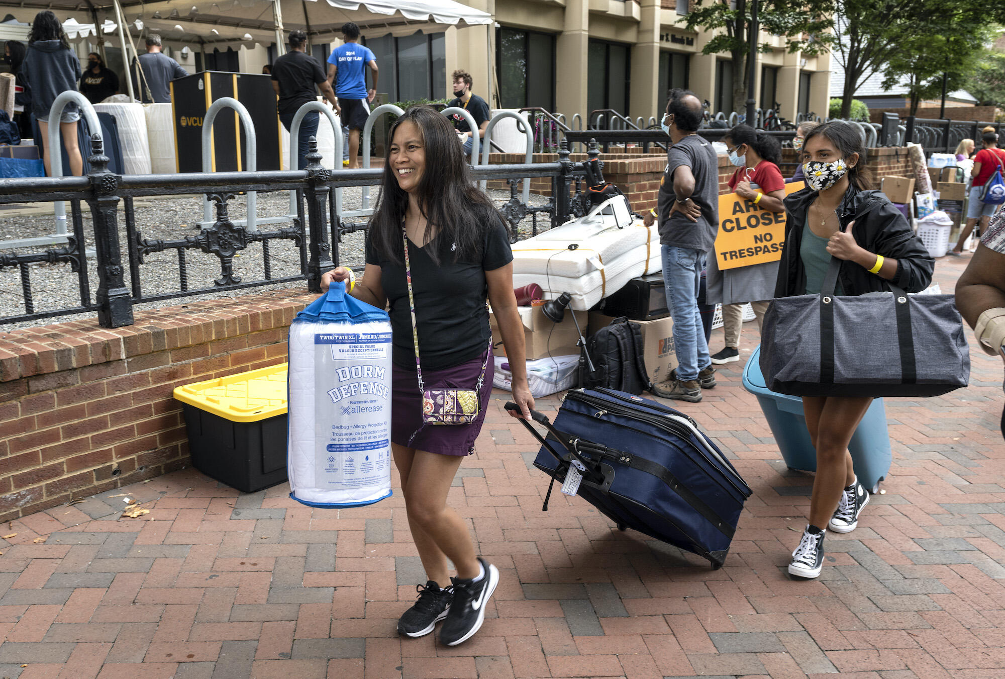 Getting a little help from family in front of Brandt and Rhodes halls.