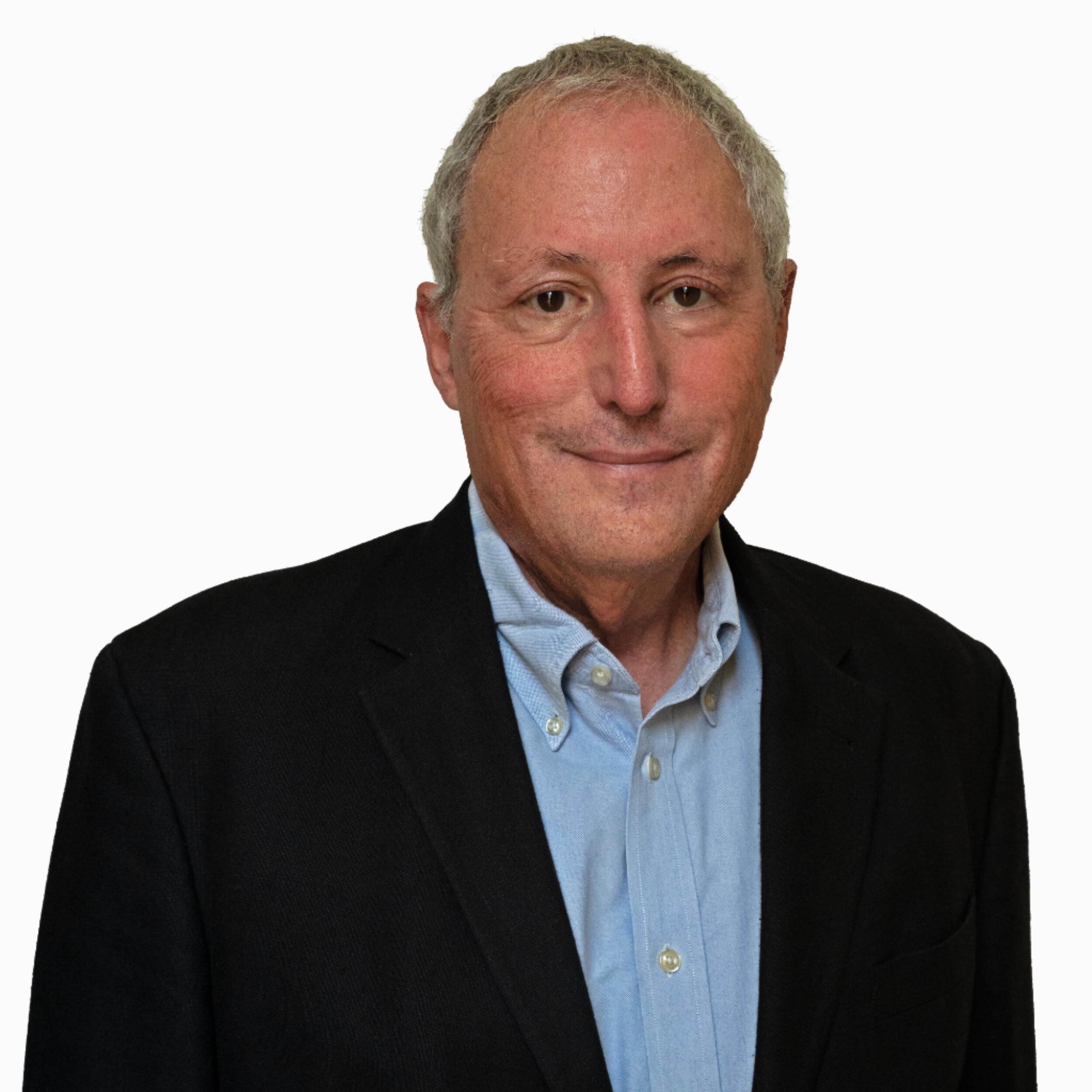 A photo of a man from the chest up. 