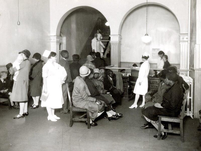 An archival image shows white patients on one side of the outpatient waiting room in the old Virginia Hospital at the Medical College of Virginia and African American patients on the other
