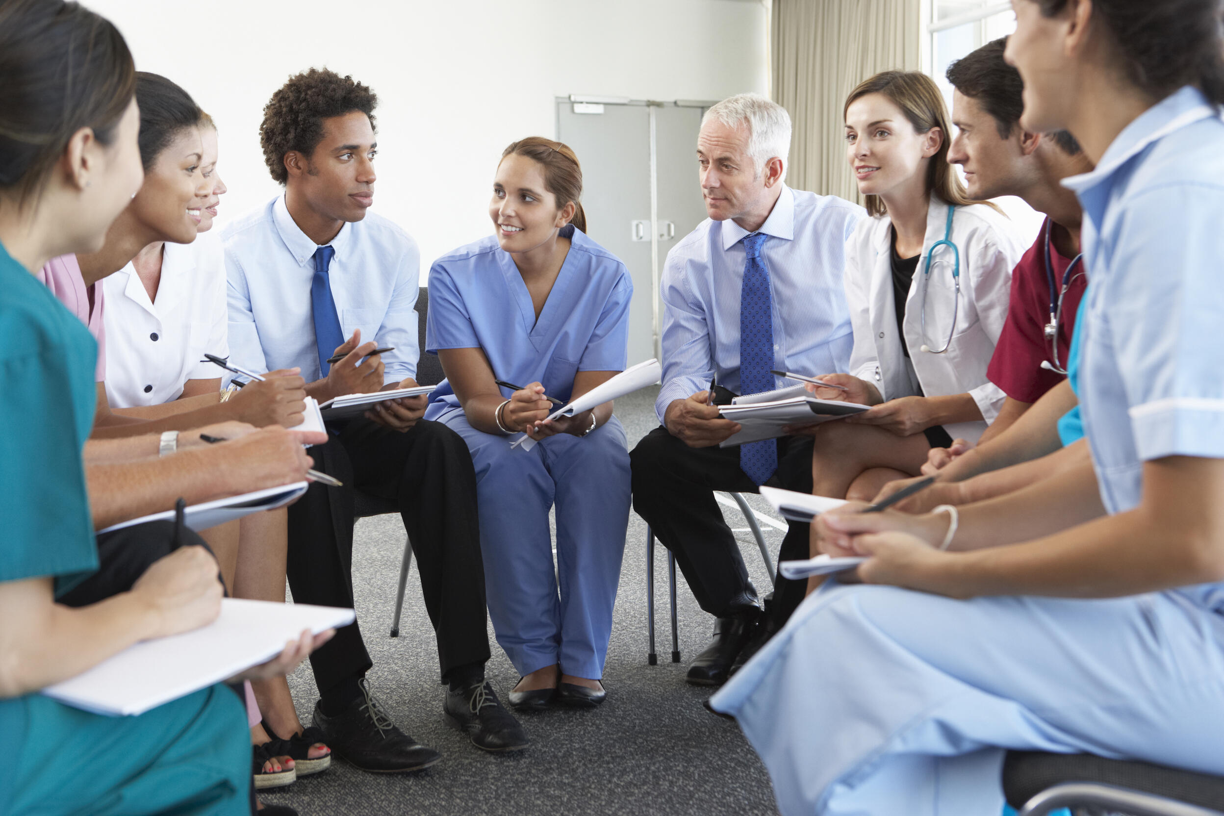 A group of medical professionals in a meeting.