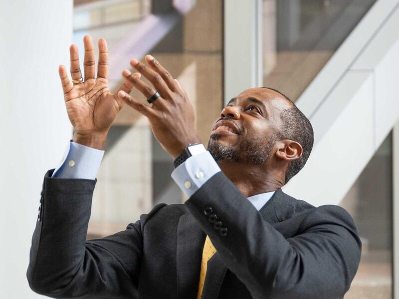 A man with his arms half extended in front of him 