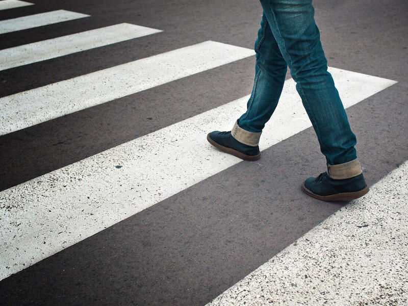 Person walking across the street
