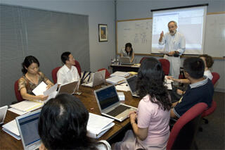 Kenneth S. Kendler, M.D., discusses interview skills for the assessment of depression in study participants  with a group of doctors based in Shanghai, China and the University of Oxford in England. Image courtesy of Jennifer Watson, Creative Services/VCU.