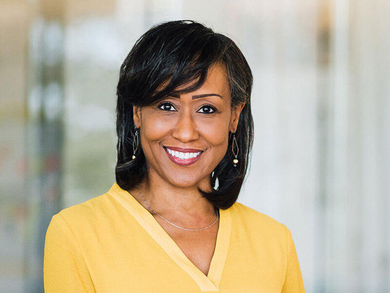 Portrait photo of woman smiling at the camera.