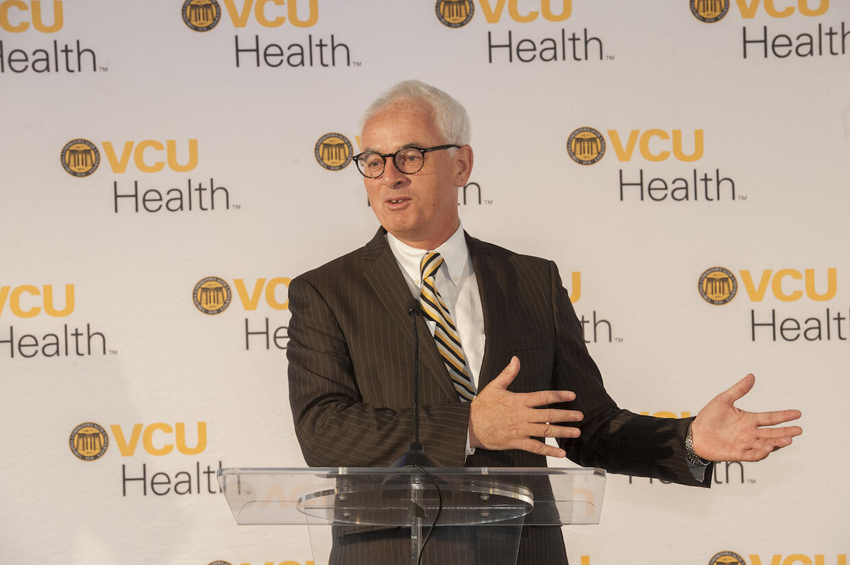Peter Buckley standing in front of a VCU Health backdrop