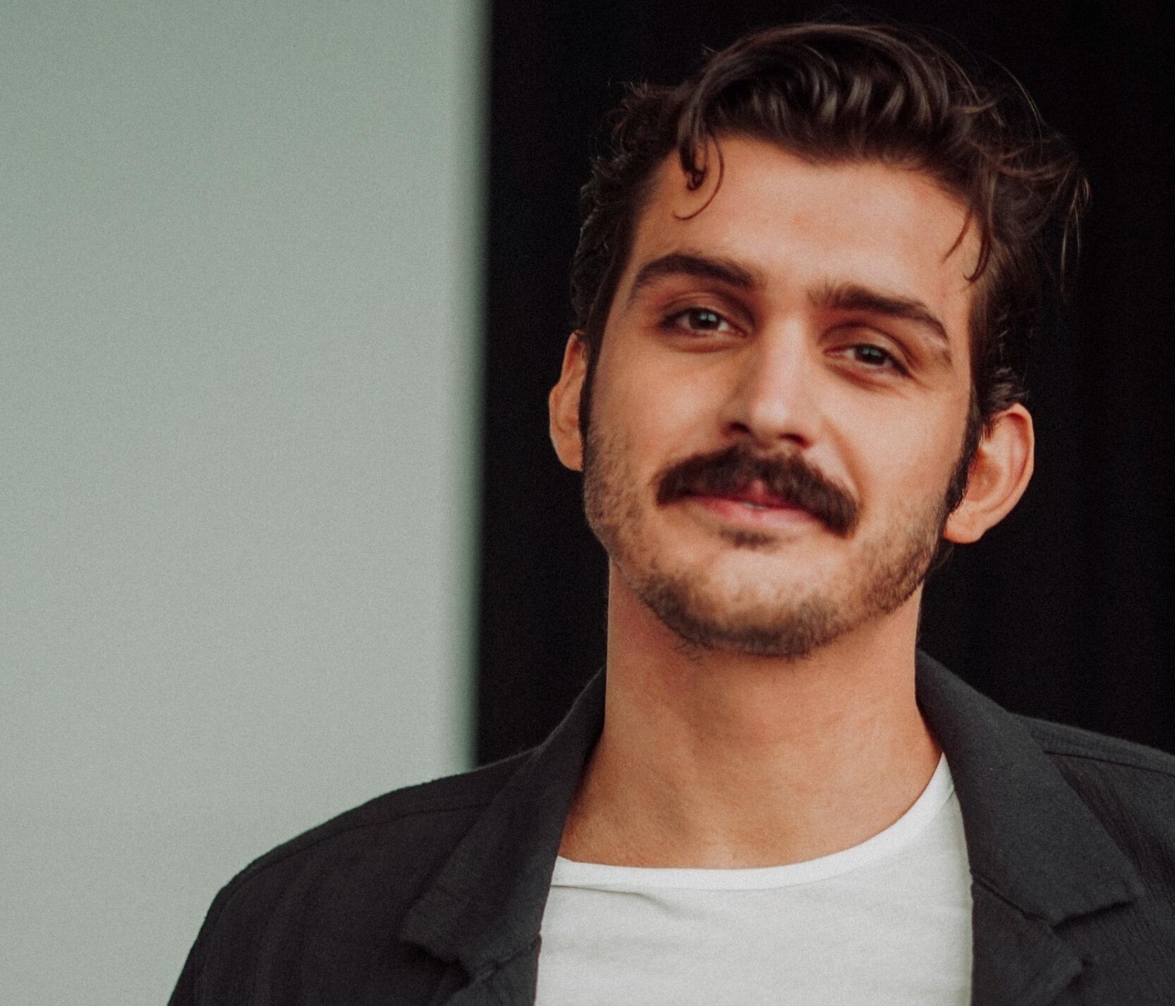 A photo of a man from the waist up